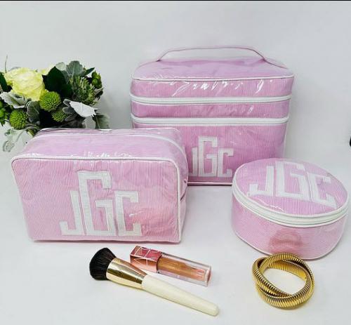 Pink pinstripe with Matt appliqué in white. Double zip Walton, 6” round and Large Milan.  Pink pinstripe with Matt appliqué in white. Double zip Walton, 6” round and Large Milan.  NULL